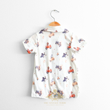 Baby romper shorts with cute colorful bears and friends in cars pattern fabric displayed on a hanger against a white background The Vintage Teddy Children's Boutique Cute Baby & Toddler Clothes