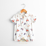Baby boys romper with bears and animals driving vintage cars fabric pattern displayed on a hanger against a white background wall. Cute clothes for Baby & Toddlers from The Vintage Teddy's online kids shop.