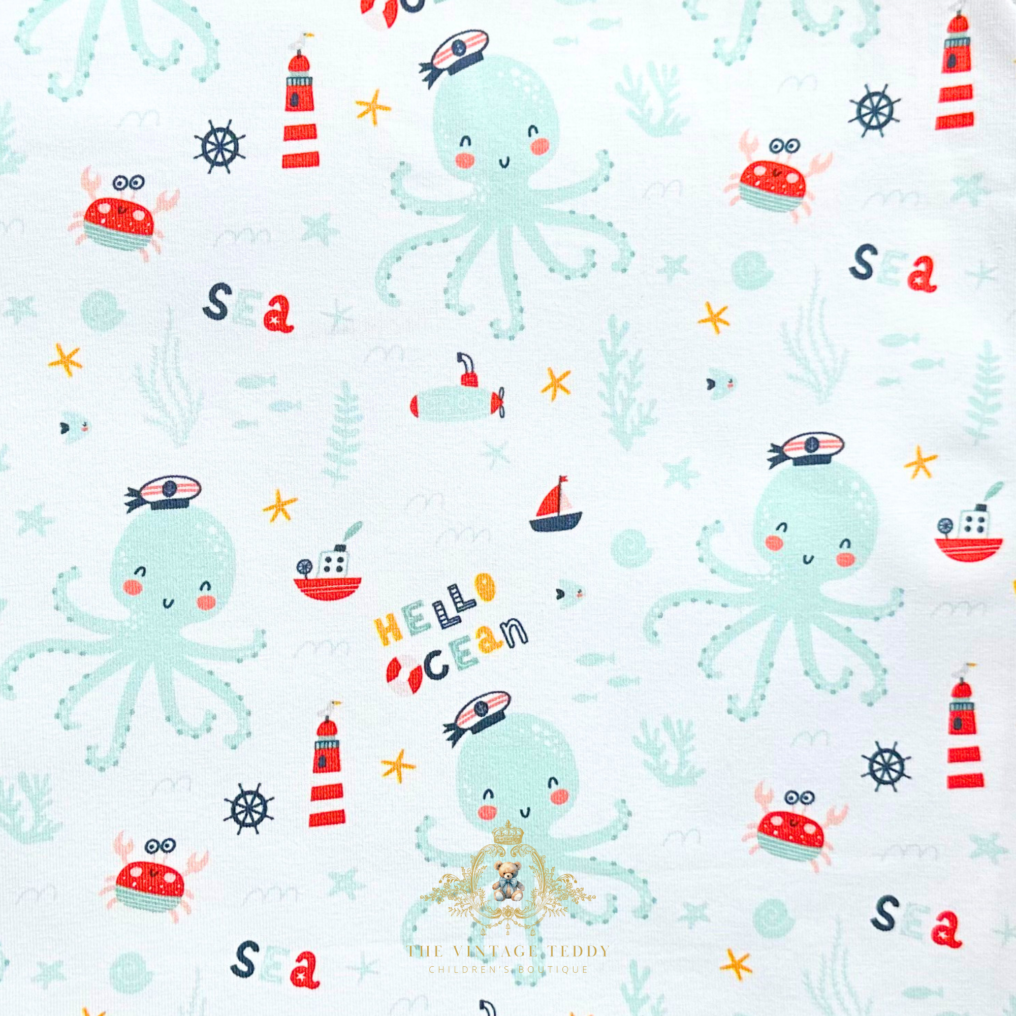 Cute fabric pattern of octopuses, lighthouses, and sea creatures on a off white background for baby one-piece rompers. The Vintage Teddy Children's Boutique Cute Baby & Toddler Clothes for Kids