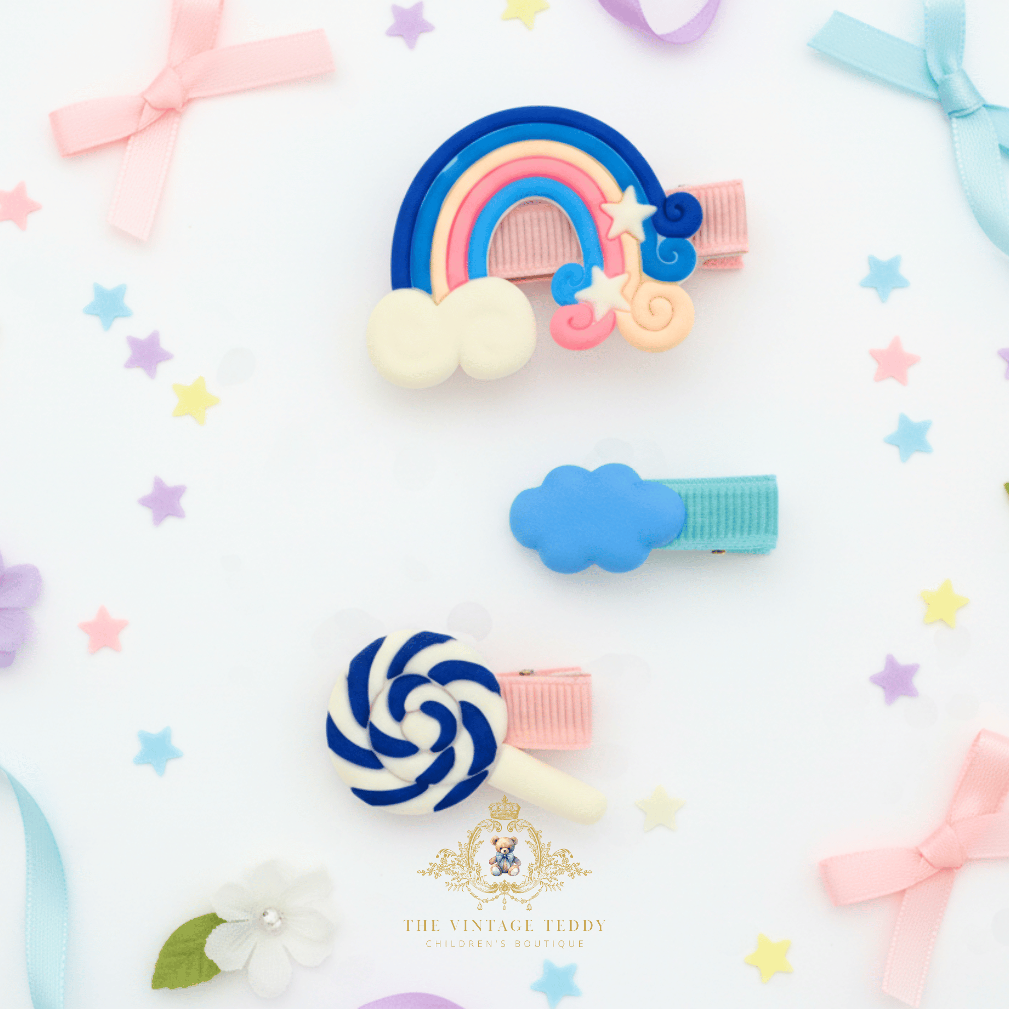 Blue rainbow and lollipop hair clips for girls – flat lay mockup of children's hair accessories from The Vintage Teddy boutique