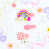 Pink rainbow and lollipop hair clips for girls – flat lay mockup of children's hair accessories from The Vintage Teddy boutique