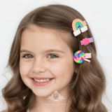 Girl wearing purple rainbow and lollipop hair clips – children's hair accessories styled on model from The Vintage Teddy boutique