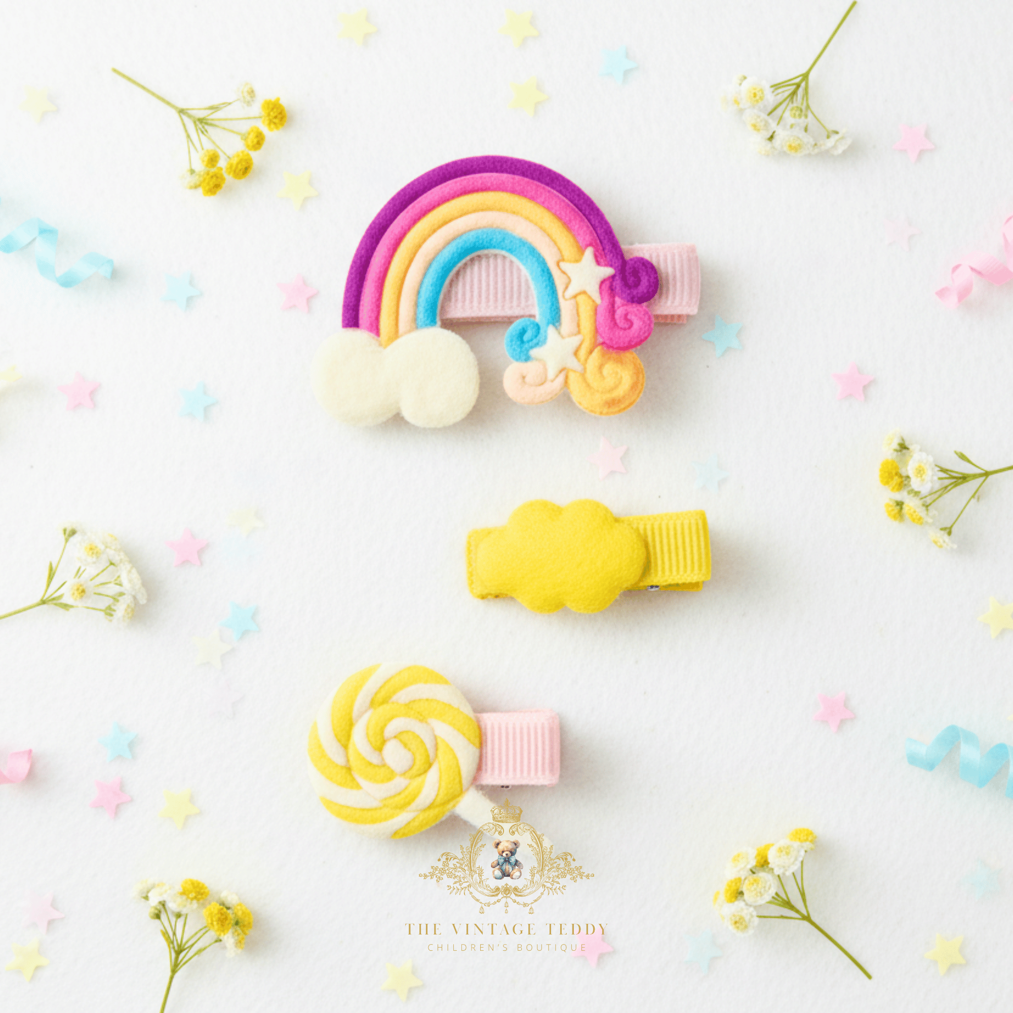 Yellow rainbow and lollipop hair clips for girls – flat lay mockup of children's hair accessories from The Vintage Teddy boutique