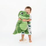Toddler boy hugging large plush alligator toy wearing alligator print matching set boys summer kids clothing