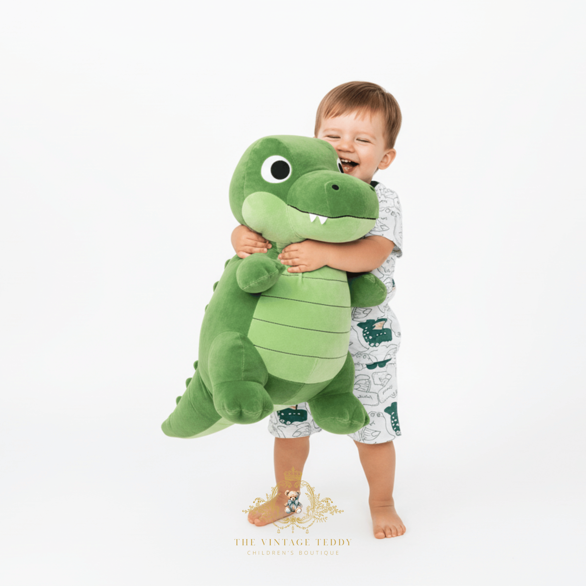 Toddler boy hugging large plush alligator toy wearing alligator print matching set boys summer kids clothing