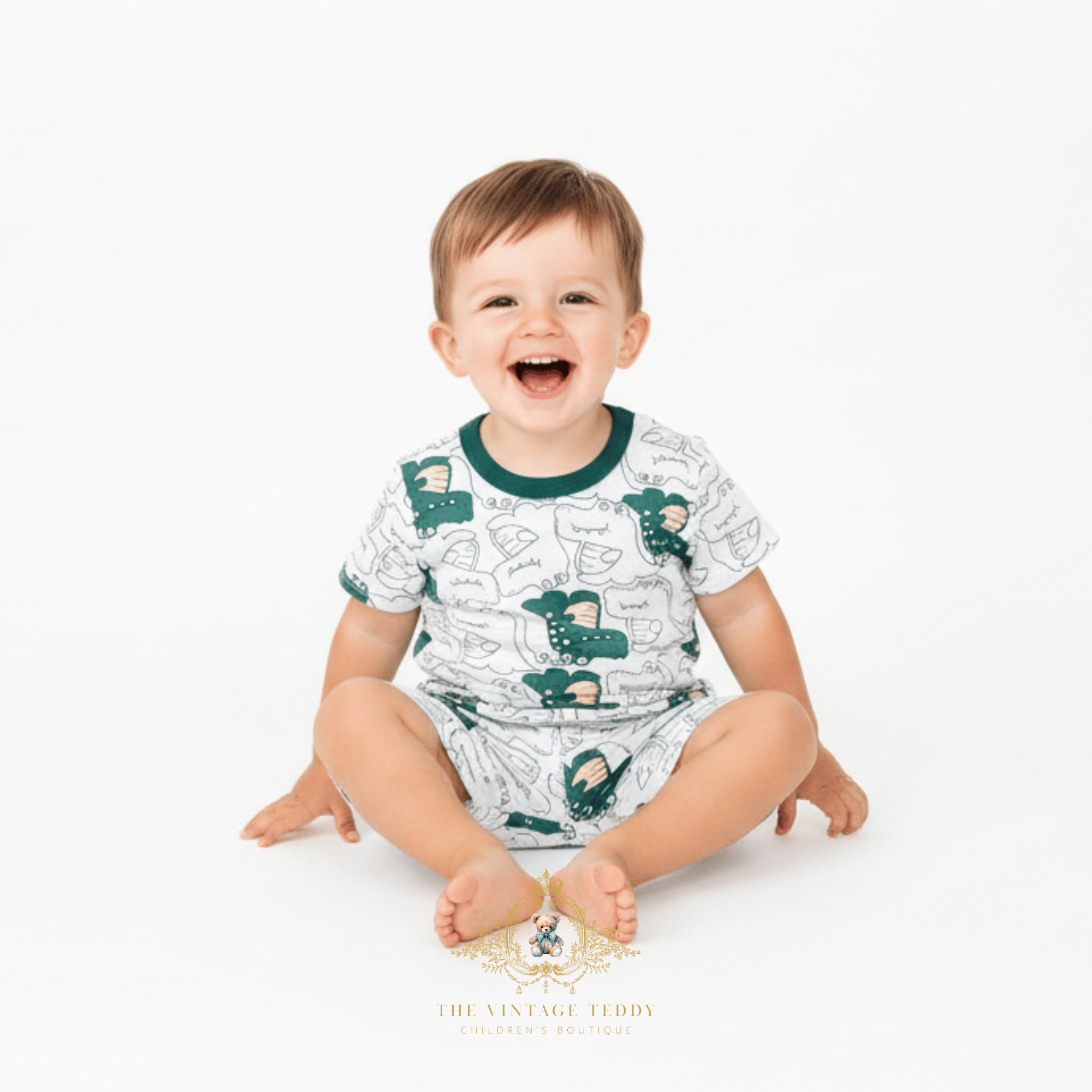 Toddler boy sitting wearing white and green alligator matching set boys cute kids clothes boutique outfit