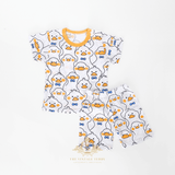 Flat lay of kids Mr. Duck graphic t-shirt and shorts front view yellow blue white matching set children's clothes