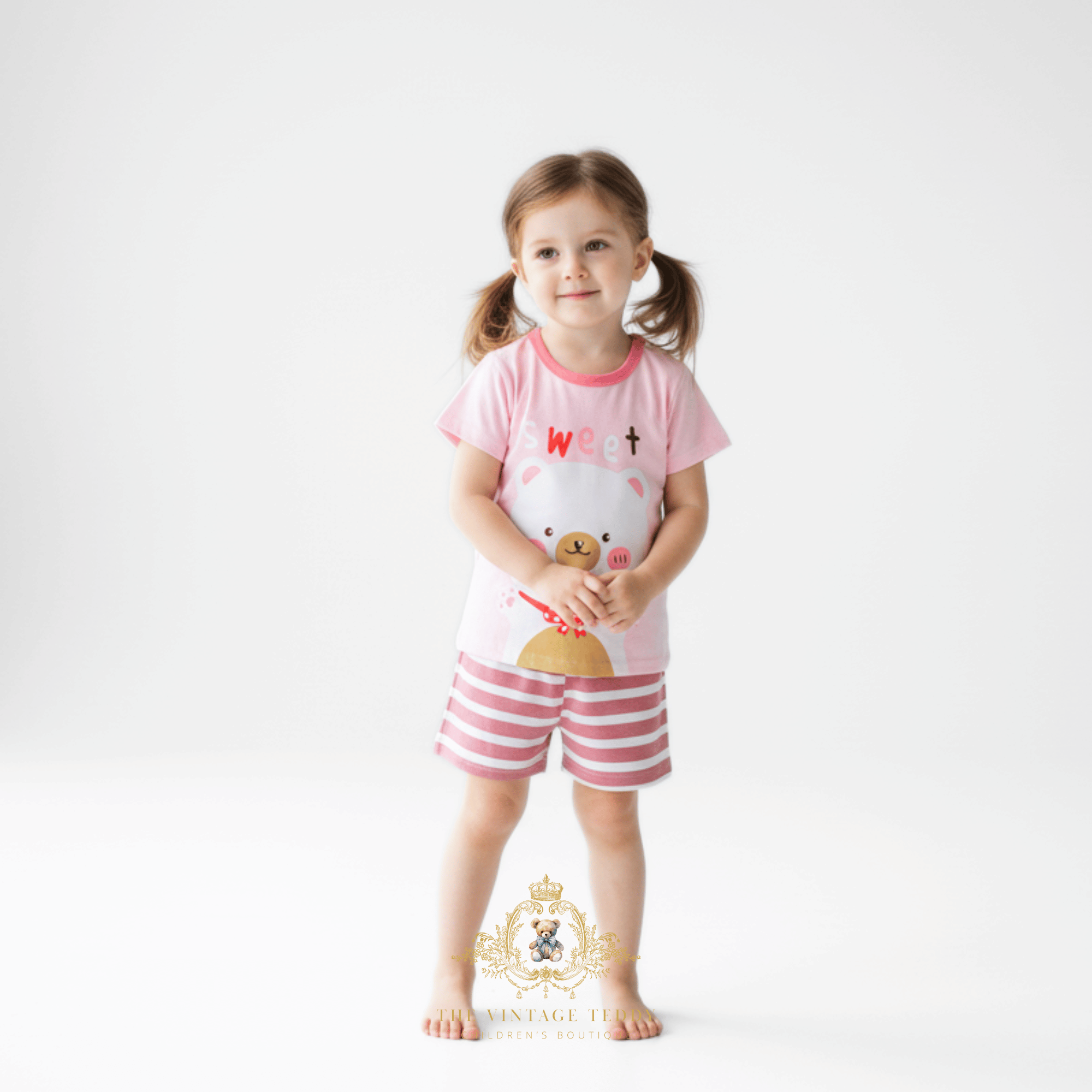 Little girl wearing a Girls Sweet Bear graphic t-shirt and shorts matching set toddler boutique children's clothing