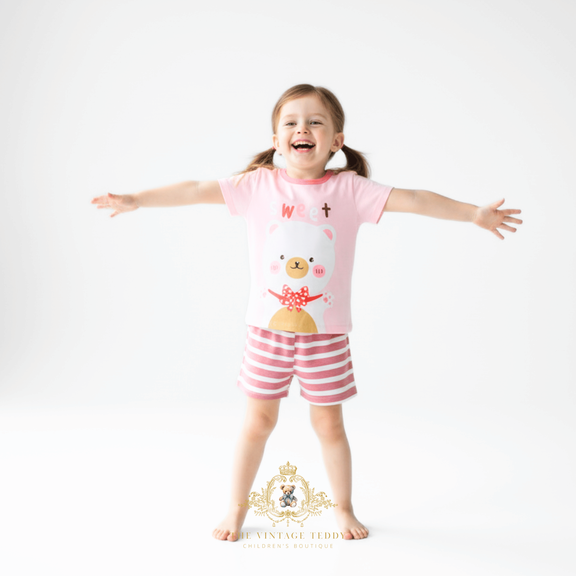 Happy toddler girl wearing Sweet Bear 2-piece matching set girls summer outfit for kids