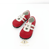 Red shoes sneakers for kids with white straps on a white background, featuring The Vintage Teddy logo.