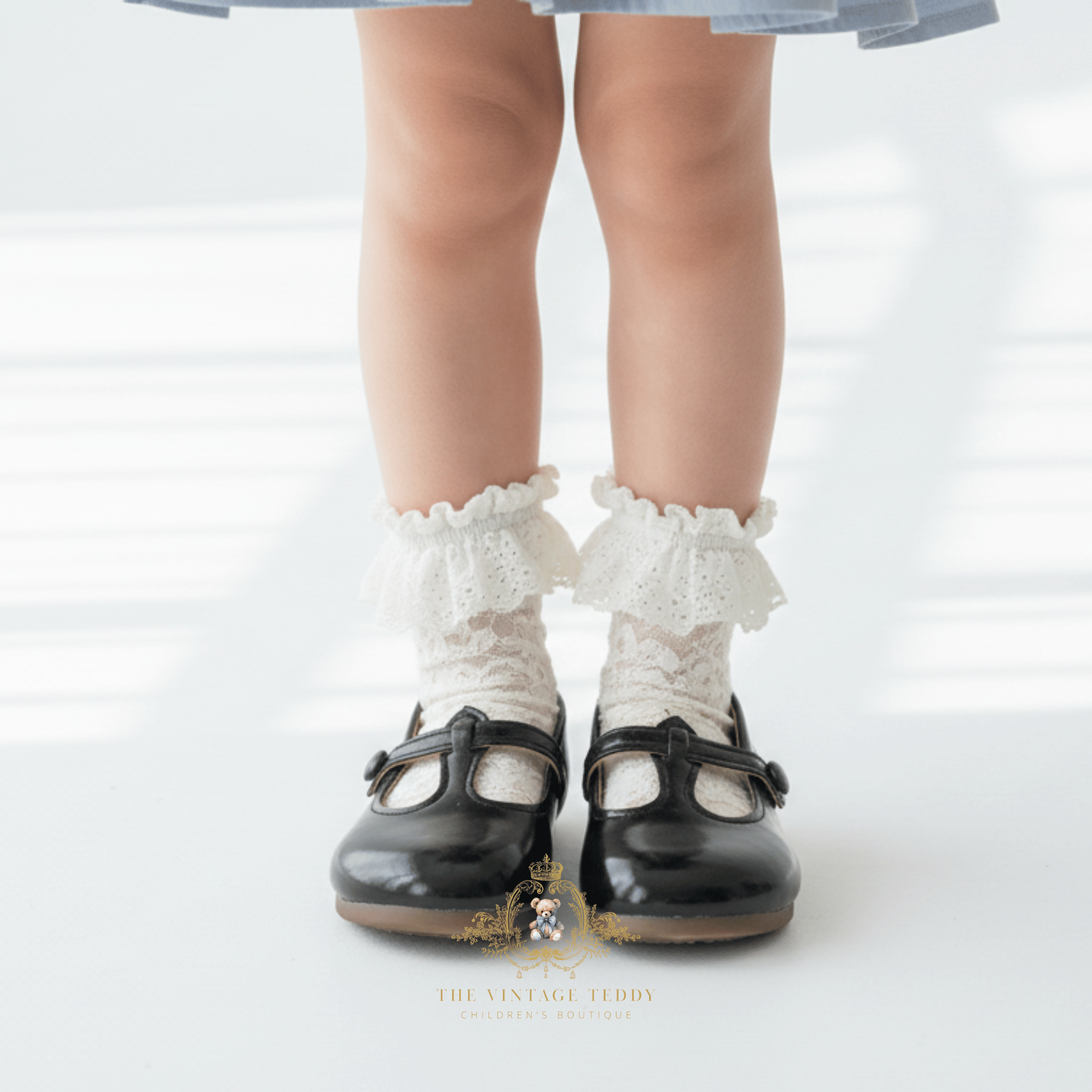 Close up of little girl wearing black Mary Jane flats toddler vintage dress kids shoes children's boutique accessories
