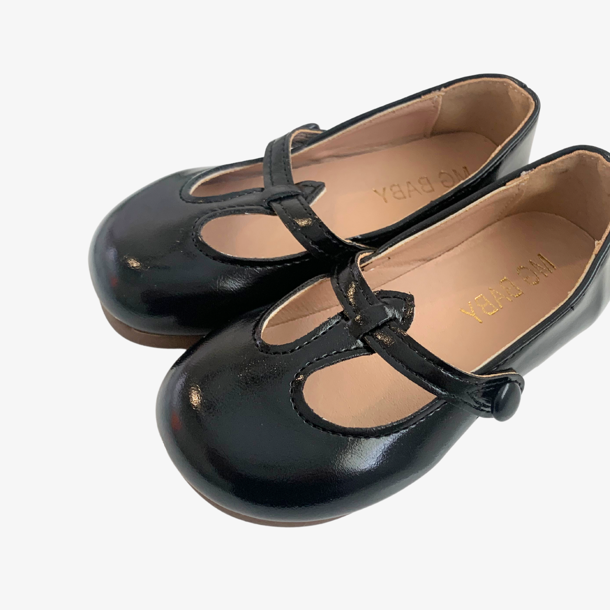 Close up detail of girls black Mary Jane flats vintage style toddler boutique shoes for kids